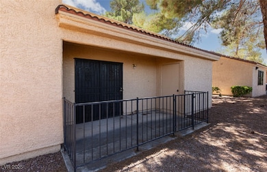 Entrance to property with stucco siding