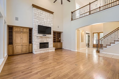 Unfurnished living room featuring light wood fini