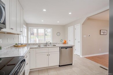 Entering into the renovated kitchen from the Famil