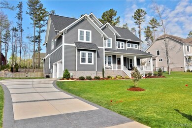Detailed stamped concrete driveway, fenced in rear