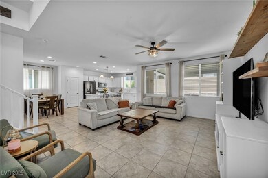 Living room with recessed lighting, ceiling fan, h