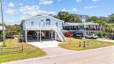 Coastal inspired home featuring a carport and a fr