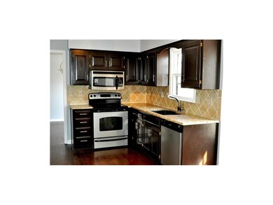 Kitchen with granite countertops, backsplash, fixt