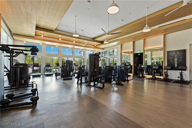 Gym featuring hardwood / wood-style floors and a t