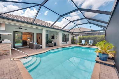 Swimming pool with area for grilling, ceiling fan, a patio area, and an outdoor living space