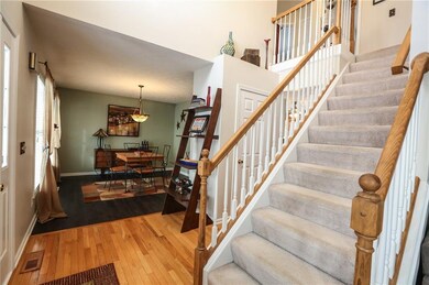 On the left, the foyer is open to the formal dinin