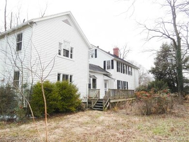 Left side of home with rear deck