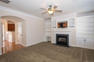 Family room with gas fireplace and built-in shelvi