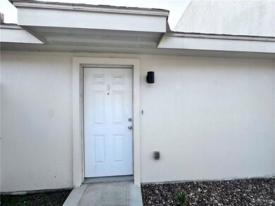 Doorway to property with stucco siding