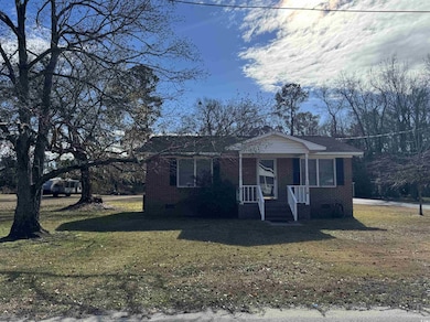 Single story home featuring a front yard