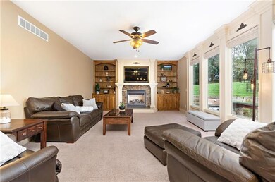 Spacious living room with built-ins, fireplace and