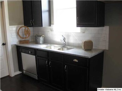 Photo of another home. Another view of kitchen sin