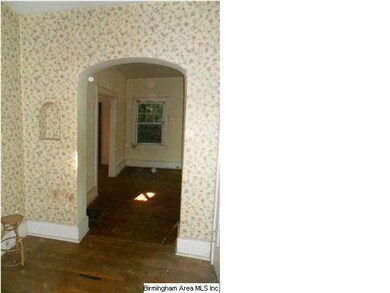 Foyer View #2, showing arched opening to forma liv