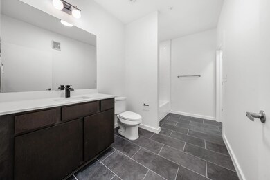 Full bath featuring visible vents, baseboards, to