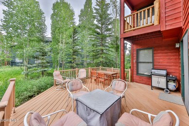 Spacious back deck with seating area