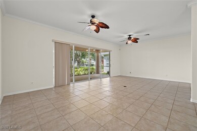 Empty room featuring ceiling fan, light tile patte
