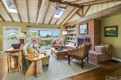 Living room with fireplace and vaulted ceilings