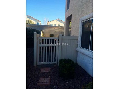Facade/Exterior Front. Side gate entrance to beaut