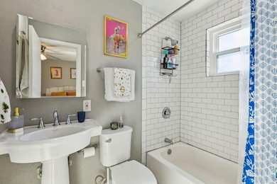 Full bath featuring shower / bath combo with showe