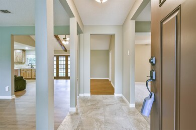 RAISED ENTRY WITH TRAVERTINE TILE.