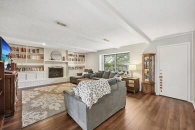 Family room with beams that add character and comp