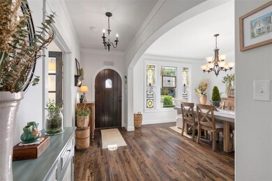 Solid wood front door leads you into the foyer wit