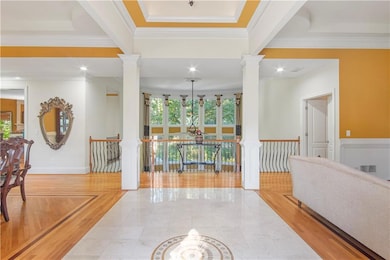 Hall featuring ornamental molding, beamed ceiling,