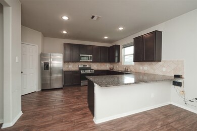 This kitchen features modern stainless steel appli