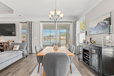 Dining area featuring dark wood-type flooring, a w