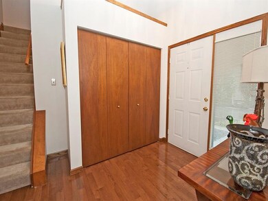 Gleaming hardwood flooring in the entry with wide 