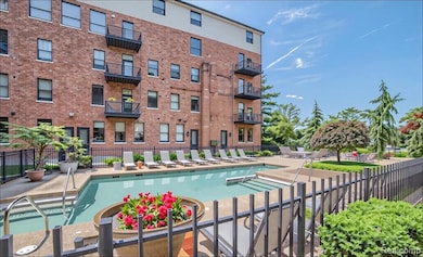 Community pool with a patio