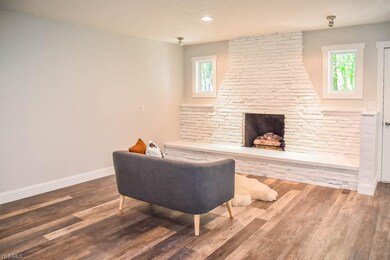 Great room with a brick fireplace.