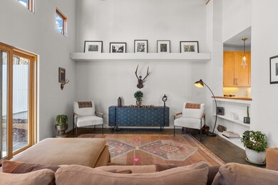 Living room with 20’ soaring ceilings