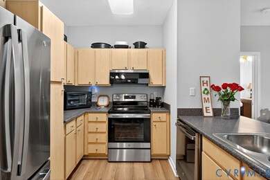 Kitchen with plenty of storage and updated stainless steel appliances.