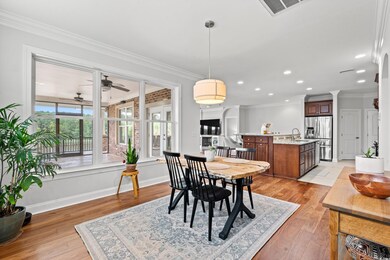 Dining area with ornamental molding, sink, ceiling