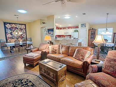 Open concept living area with beautiful wide-plank