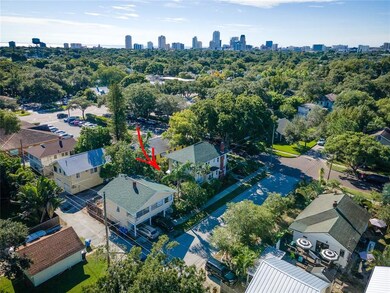 View of home, garage/apartment, and alley from 10t