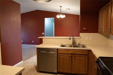 Kitchen featuring a notable chandelier, stainless 