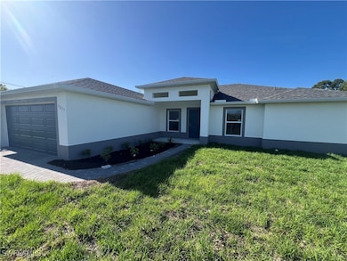 View of front facade featuring an attached garage,