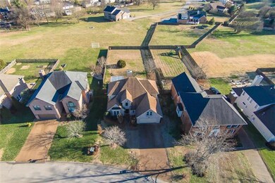 An aerial view shows the vast lot dimension, especially at the rear of the property, that adjoins Forrest Crossing common area, & beyond, a neighboring subdivision...