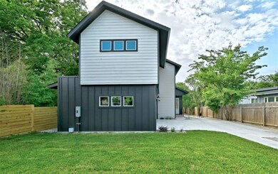Back of property with a yard, a patio, a fenced b