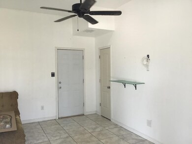 The Downstairs Entry/Foyer Leads to a Staircase fo