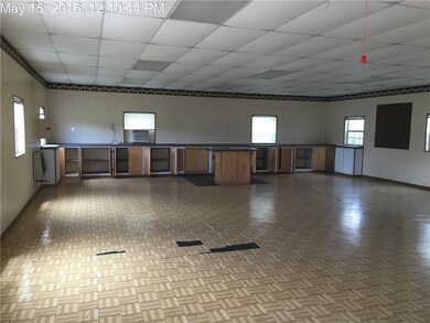 Interior of workshop/garage. Has window unit and w