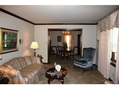 Formal living room is open to the dining room!  Gr
