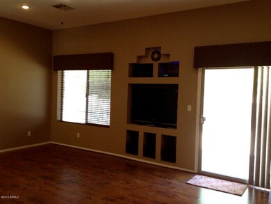 Livingroom Slider and Wide Wood Flooring