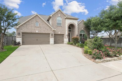 3 car attached garage with wide driveway