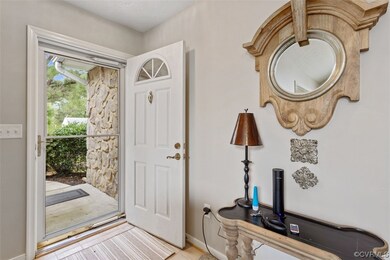Tiled entryway featuring a textured ceiling