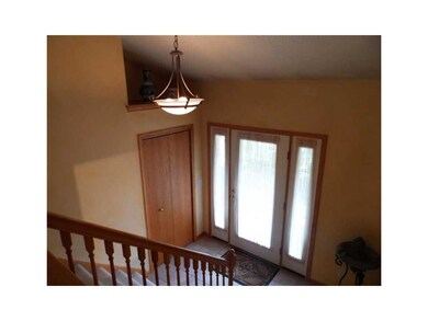 Foyer. 2 story front foyer with oak steps.