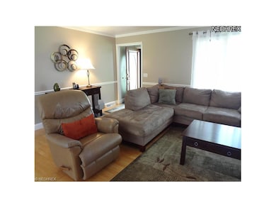 View #2 of the living room, front foyer, cove mold