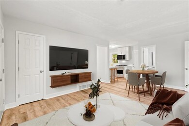 Living area featuring light wood-type flooring and